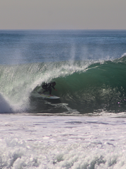 Tyler Gunter in a barrel on his XYZ performance shortboard by Surf Prescriptions